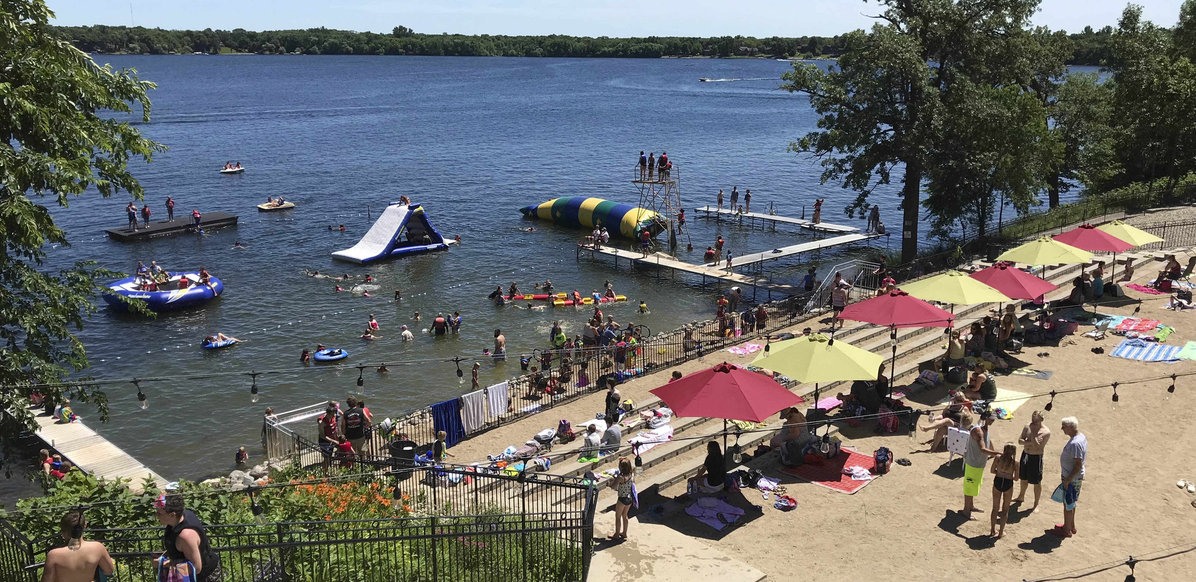 Beach with people under umbrellas